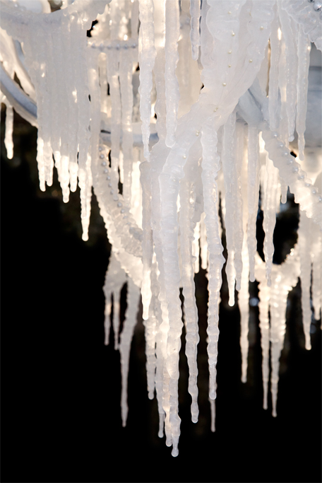 Detail of the formation of icicles dangling in the sunlight.